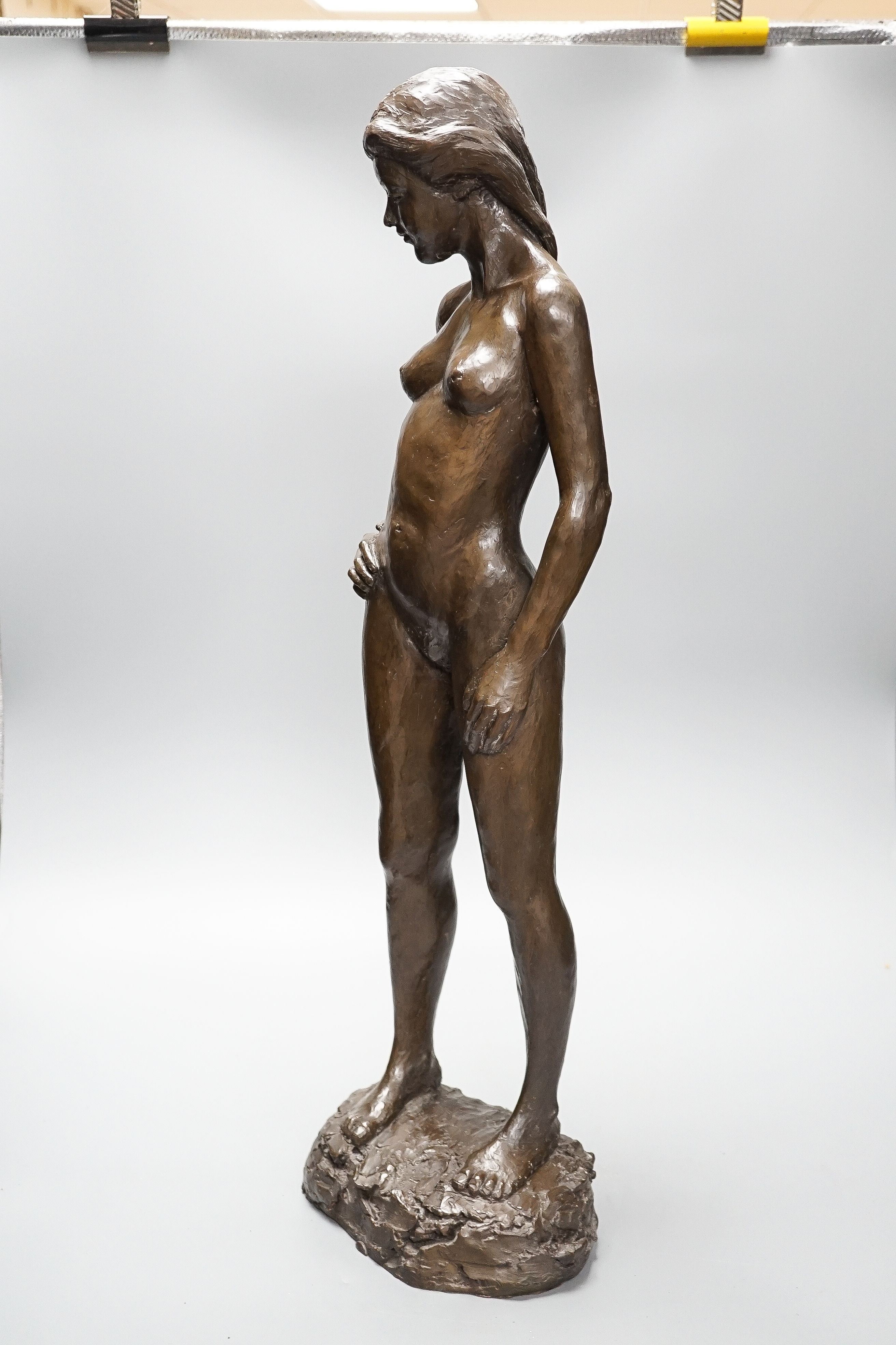 A large bronzed resin figure “Fiona standing” signed Kerek ‘83 64cm